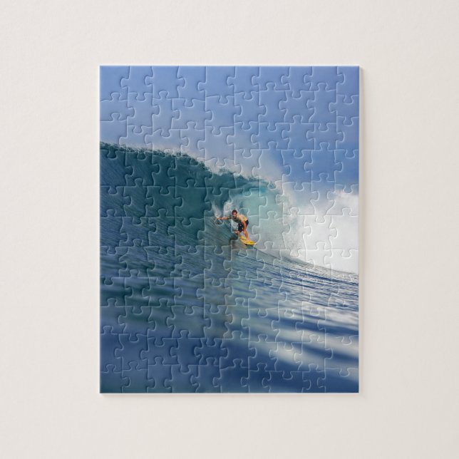 Surfer surfing large blue reef wave jigsaw puzzle (Vertical)