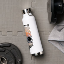 Surfer Walking Into Beach At Sunset