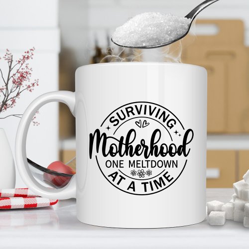Surviving Motherhood One Meltdown at a Time Coffee Mug