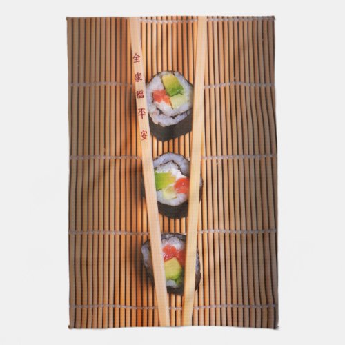 Sushi and wooden chopsticks kitchen towel