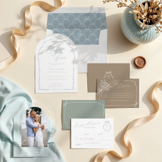 A flat lay of stationery items in soft neutrals and beige tones, arranged with warm ribbon and delicate florals. The composition is clean and editorial. Organic textures add refinement. It communicates cohesion and branded aesthetic direction.