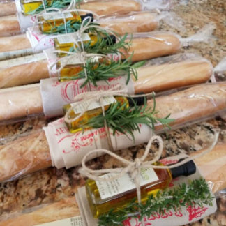 An overhead view of rolled wrapping paper with festive patterns and rustic ribbons. The setup feels homemade, warm, and personalized.