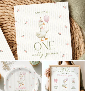 A first birthday invitation with an illustrated goose holding a balloon, styled beside matching party plates and a milestone birthday poster in soft cream and pink florals.