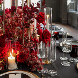 Deep red table decorations. 