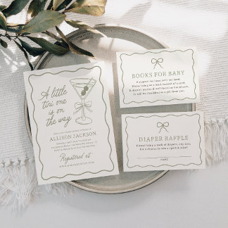 A set of baby shower game cards with soft neutral colors, delicate borders, and simple typography arranged on a plate. The design feels minimal, classic, and softly elegant.