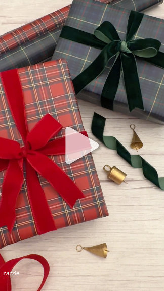 Tartan plaid gift wrapping with red velvet and green ribbons, styled with brass bells on wood. Cozy, traditional, holiday-wrapping mood.