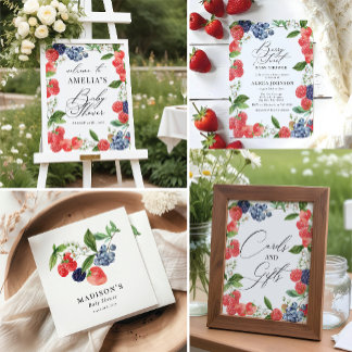 coordinated baby shower stationery and signage collection featuring watercolor berries and greenery, styled across invitations, welcome signs, and table signs. The design feels fresh, garden-inspired, and softly elegant with a cohesive botanical theme.