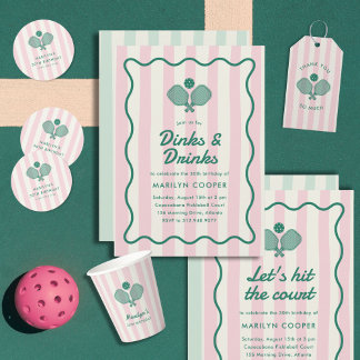 A green and pink invitation suite with striped patterns and cocktail illustrations arranged in a flat lay. The design has a preppy, retro feel with clean lines and playful drink-themed graphics.