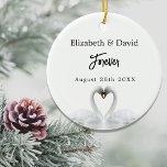 Swans love white names wedding ceramic ornament<br><div class="desc">Two beautiful swans in love on a lake bending their heads toghether and forming a heart. White elegant background.  Personalize and add your names and a date.  Your wedding date,  or an event to remember. 

A swan couple stay together for life,  so they are the perfect symbol of love.</div>