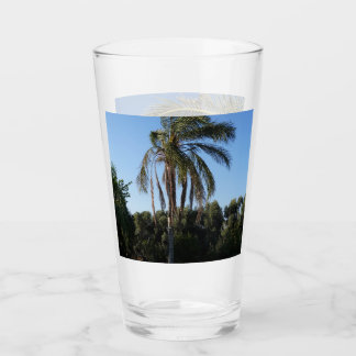 Swaying Palm Tree Under a Clear Sky Glass