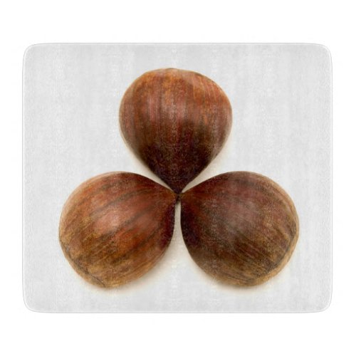 Sweet chestnuts fruits cutting board