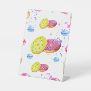 Sweet donuts with colourful glaze pattern pedestal sign