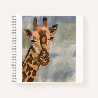 Sweet giraffe on journal
