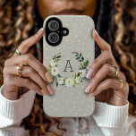 Sweet Greenery Wreath and Greige Dots Monogram iPhone 16 Case<br><div class="desc">Custom monogrammed phone cases personalized with your initial or other text. This simple farmhouse inspired design features a watercolor wreath of greenery and white flowers on a neutral taupe polka dot background. Add your monogram letter in the botanical frame. Use the design tools to choose any background color, change text...</div>