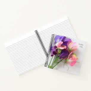 Sweet peas on textured paper gardening notebook