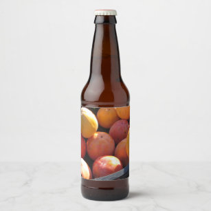 Sweet persimmon kaki fruits in plastic box beer bottle label