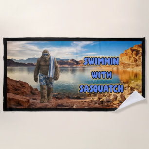 Swimmin With Sasquatch” beach towel