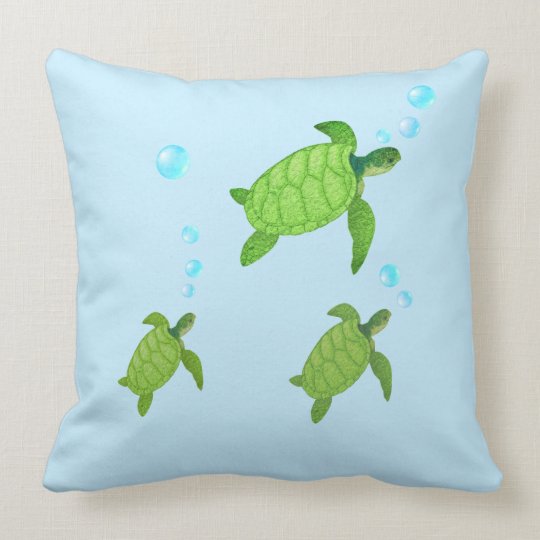 Swimming green sea turtles on turquoise throw pillow