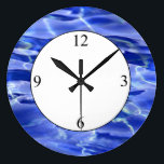 Swimming Pool Large Clock<br><div class="desc">Swimming Pool. Photo of a swimming pool featuring bright shades of blue. If you liked this image and would like to see it on any other product, please send me a message and I'll be glad to create the product for you. Please visit www.zazzle.com/lsarmentoart for more unique products.</div>