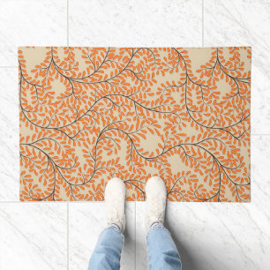 Swirling Orange Leaves on Beige Background Doormat