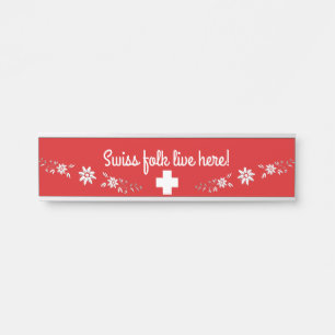 Swiss flag and edelweiss door sign