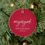 Sydney Red First Christmas Engaged Modern Ceramic Ornament<br><div class="desc">Modern Christmas ornament featuring a contemporary typographic design with "engaged" in elegant script typography along with your names and engagement date in a simple and minimal layout. The back has your favorite photo. The color theme is red and may be changed the design editing tool. This minimalist style ornament is...</div>
