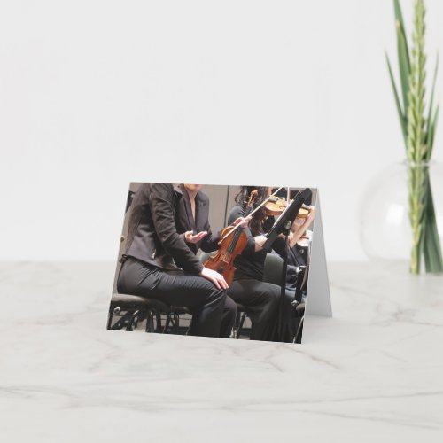 Symphony orchestra violinists note card
