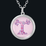 T monogram decorative letter necklace<br><div class="desc">Pretty letter T monogram pendant. Whimsical letter drawing of the capital initial letter T ideal for gifting girls with a name that begins with T. Background color can be changed if required,  currently light pink. © Original drawing and design by Sarah Trett www.sarahtrett.com for www.mylittleeden.com</div>