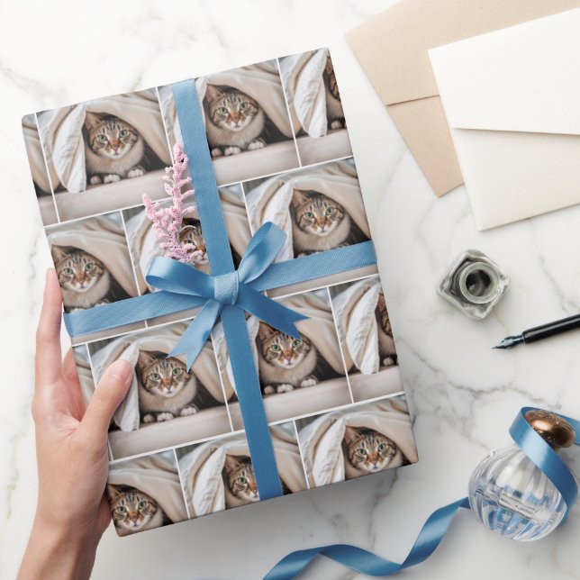 Tabby Cat Hiding Under a Blanket Wrapping Paper (Gifting)
