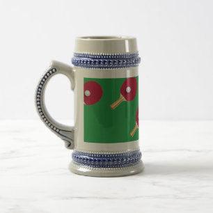 Table tennis racket and ball on green beer stein