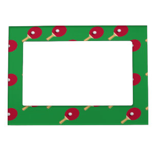 Table tennis racket and ball on green magnetic frame