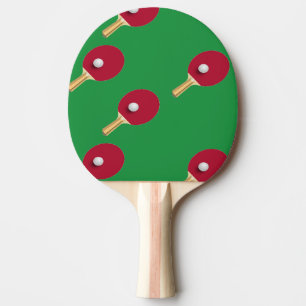 Table tennis racket and ball on green ping pong paddle