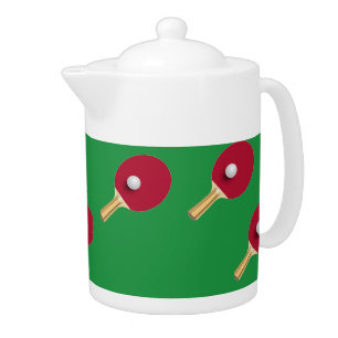 Table tennis racket and ball on green teapot