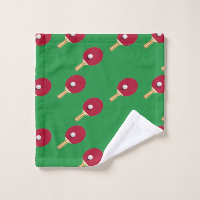 Table tennis racket and ball on green wash cloth (Wash Cloth)