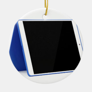 Tablet computer on white ceramic ornament