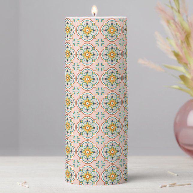 Tall candle with an intricate floral pattern (In Situ)