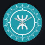 Tamazgha - Amazigh Symbol Cyan Large Clock<br><div class="desc">Tamazgha or Tamazɣa (in Tifinagh script: ⵜⴰⵎⴰⵣⵖⴰ) is an Amazigh word employed for the area equally known as the Greater Maghreb,  covering the area between the Mediterranean Sea and the Niger River,  from Siwa Oasis to the Canary Islands.</div>