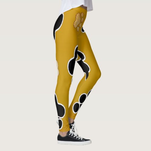 Tan and black paw print on a gold background 2 leggings