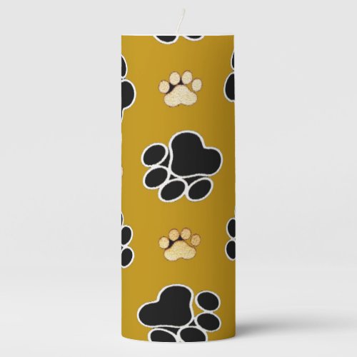 Tan and black paw print on a gold background 2 pillar candle
