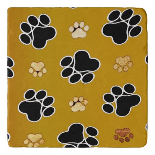 Tan and black paw print on a gold background 2 trivet