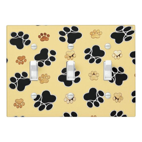 Tan and black paw print on a gold background 3 light switch cover