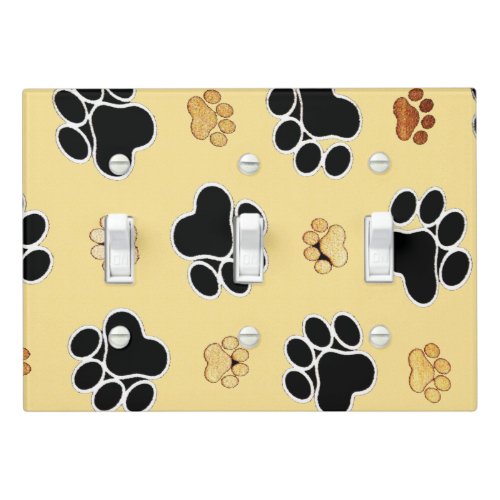 Tan and black paw print on a gold background 3 light switch cover