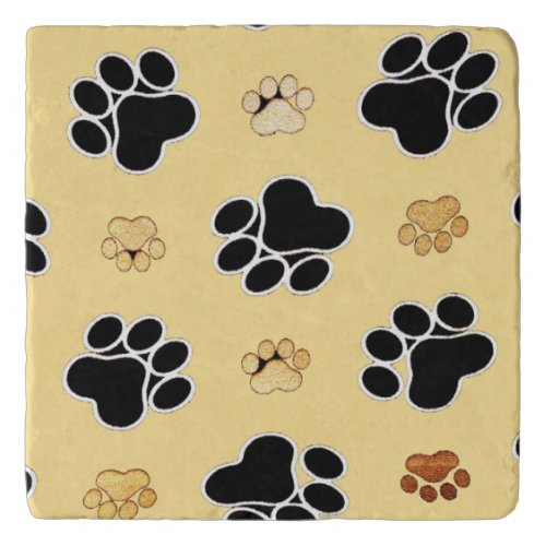 Tan and black paw print on a gold background 3 trivet