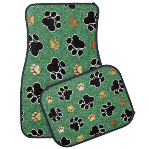 Tan and black paw print on green grass car mat