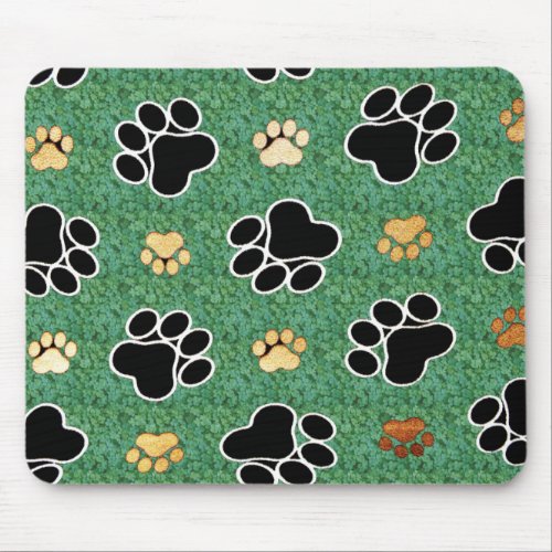Tan and black paw print on green grass mouse pad