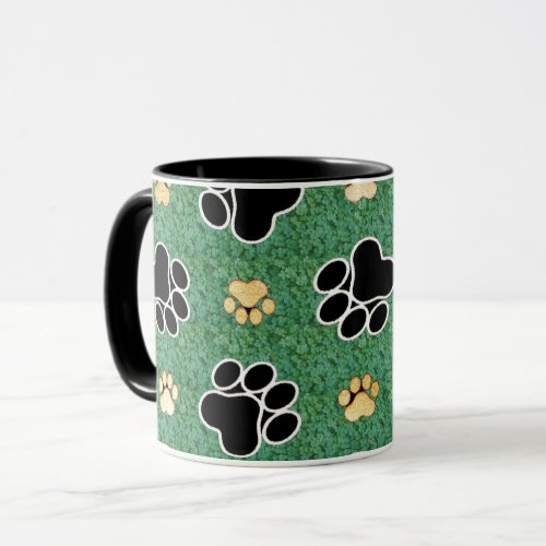 Tan and black paw print on green grass mug