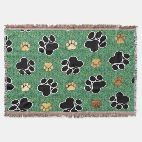 Tan and black paw print on green grass throw blanket