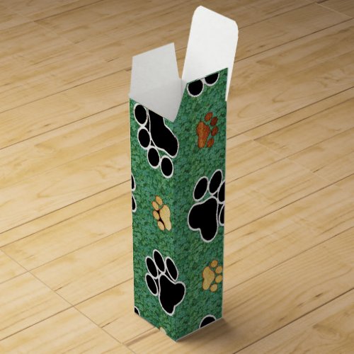 Tan and black paw print on green grass wine box