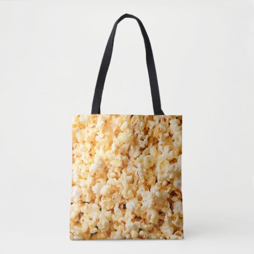 Tasty popcorn on whole background Food  Tote Bag