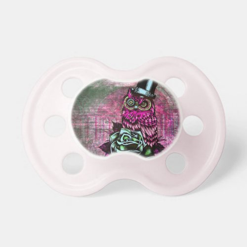 Tattoo style owl with top hat in pink and green pacifier